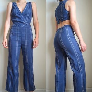 blue striped jumpsuit with cut outs from free people 
size 2 / fits size small